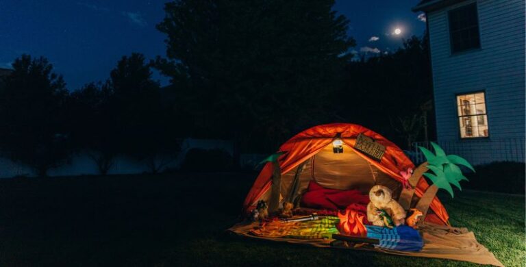 backyard camping under the night sky. featuring a tent set up for the adventure.